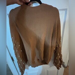 Brown sweater with pearls on sleeve